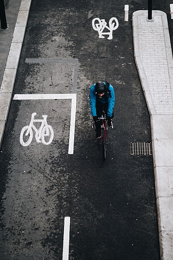 High Angle Cyclist Riding in Urban Bike Lane