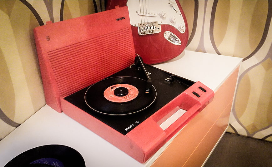 Vintage Pink Philips Record Player with Vinyl and Guitar