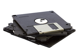 Stack of black 3.5-inch floppy disks on white background