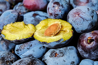 Fresh Blue Plums With Halved Fruit And Stone