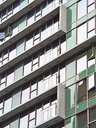 Modern Office Building Facade with Glass Windows and Balconies
