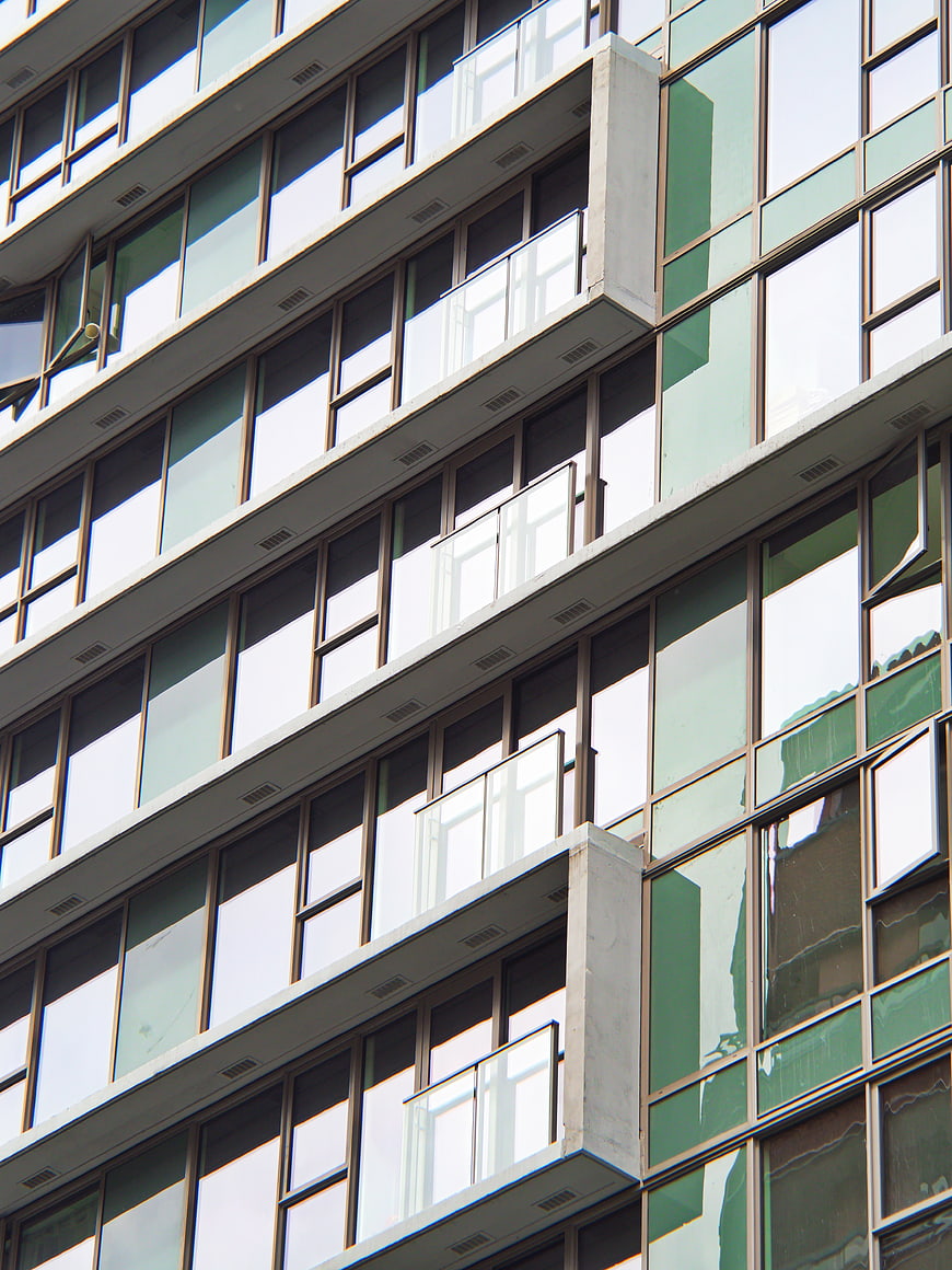 Modern Office Building Facade with Glass Windows and Balconies