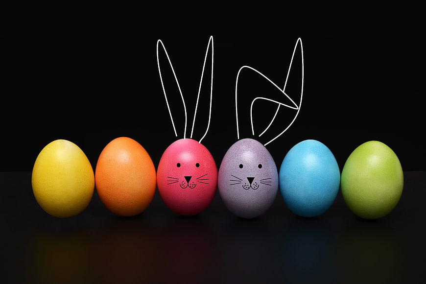 Colorful Easter Eggs with Bunny Ears on Black Background