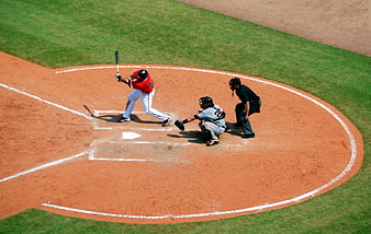 High Angle Baseball Batter Swinging at Home Plate