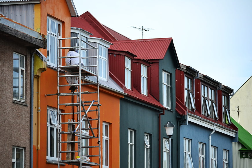Colorful Reykjavik Houses with Scaffolding and Worker