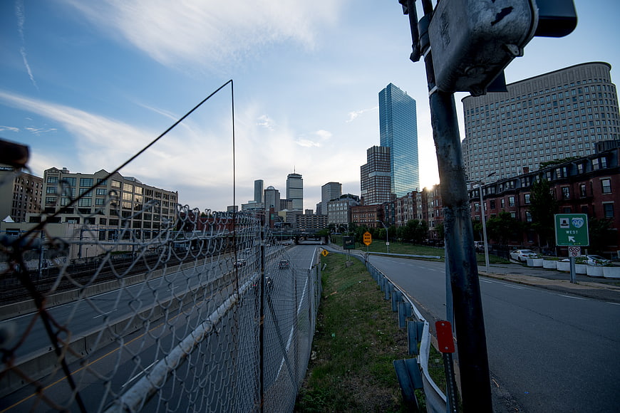 Urban Cityscape View Through Chain Link Fence