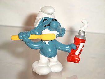 Smurf Figurine Brushing Teeth With Toothbrush And Toothpaste Tube