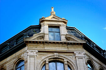 Historic 1904 building facade against blue sky