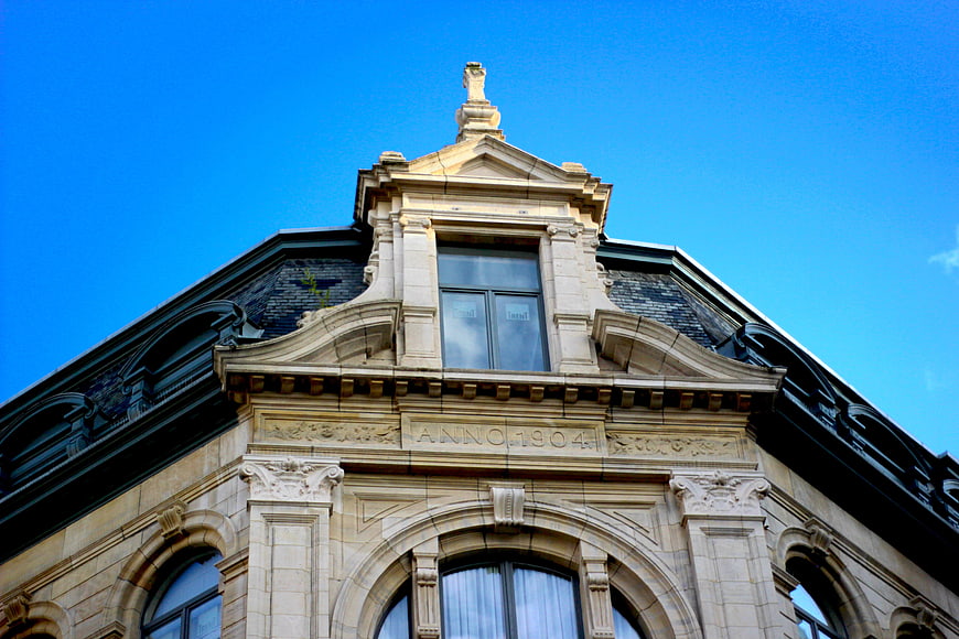 Historic 1904 building facade against blue sky