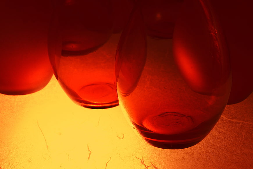 Close-up of amber glass bottles with warm lighting