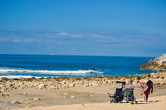Surfing and Photography on a Sunny Rocky Beach
