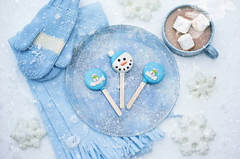 Winter snowman cake pops with hot chocolate and blue mittens