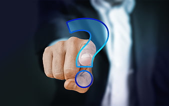 Businessman touching blue question mark on glass screen