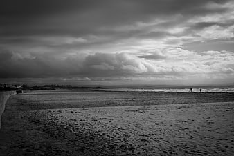 Moody Black and White Beach Landscape with Dramatic Clouds