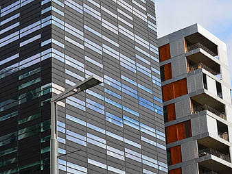 Modern Gray High-Rise Building with Glass Facade