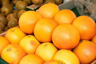 Fresh Oranges and Kiwis at a Fruit Market