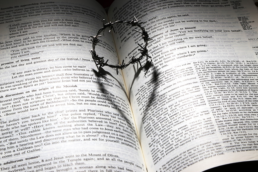 Crown of thorns on open bible pages