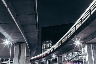 Night view of modern concrete highway overpass with streetlights