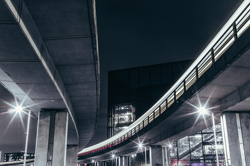Night view of modern concrete highway overpass with streetlights
