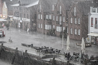 Heavy Rain Storm in European Town Square