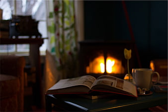 Cozy Reading Scene with Fireplace and Open Book