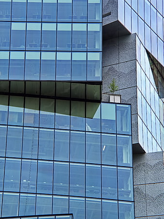 Modern Glass Office Building Facade with Geometric Design