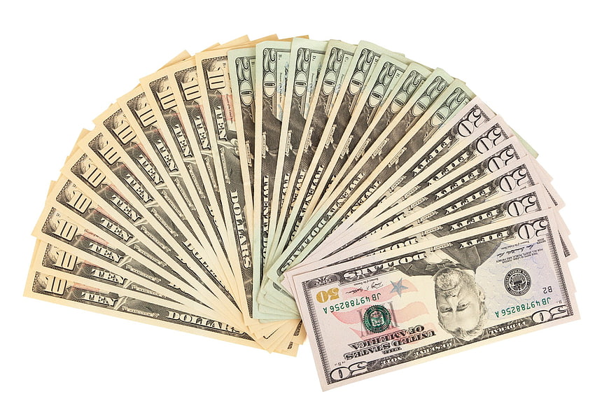Fan of US Dollar Bills Isolated on White Background
