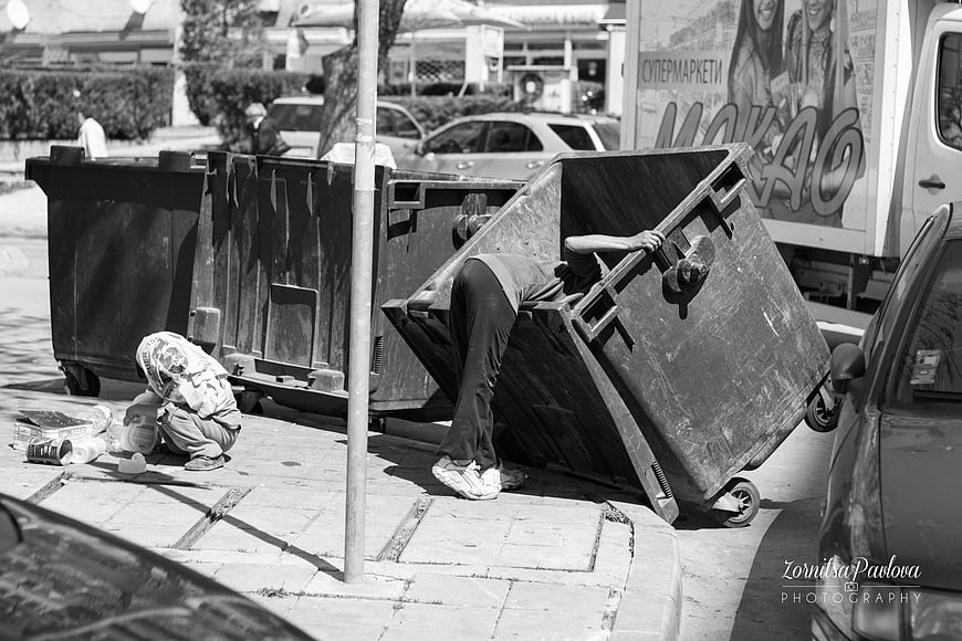 Street Photography of People Searching Through Large Garbage Containers