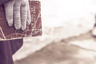 Hand in Glove Holding The Catcher in the Rye Book