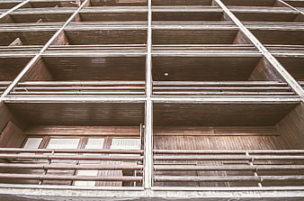 Low angle view of modern wooden apartment balconies