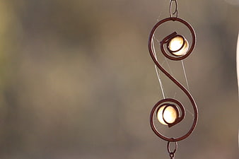 Rustic metal treble clef wind chime with glowing lights