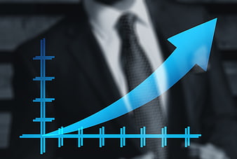 Blue growth arrow graph over blurred businessman background