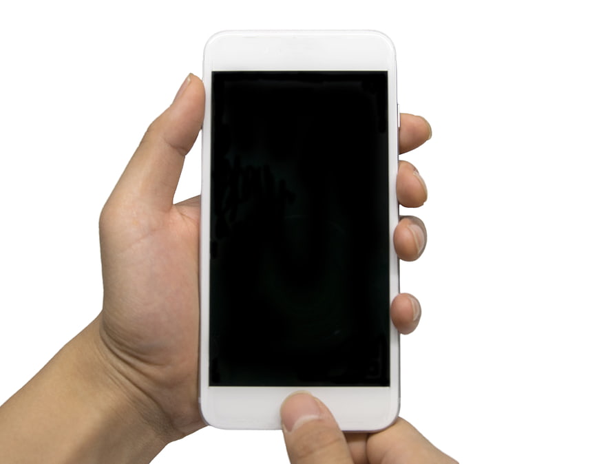 Hand holding white smartphone with black screen isolated on white