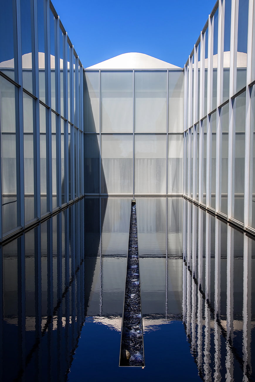 Modern minimalist architecture with reflective water pool