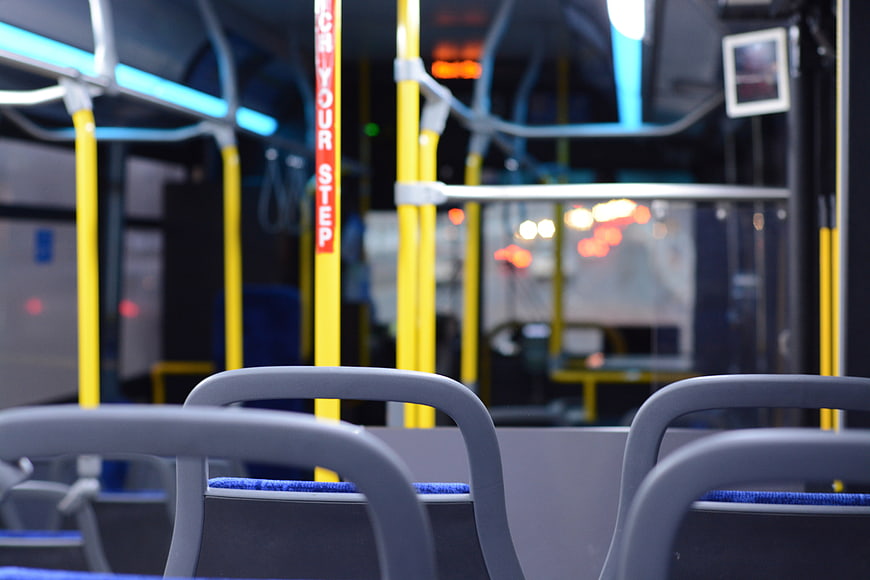 Empty interior of a modern city bus at night
