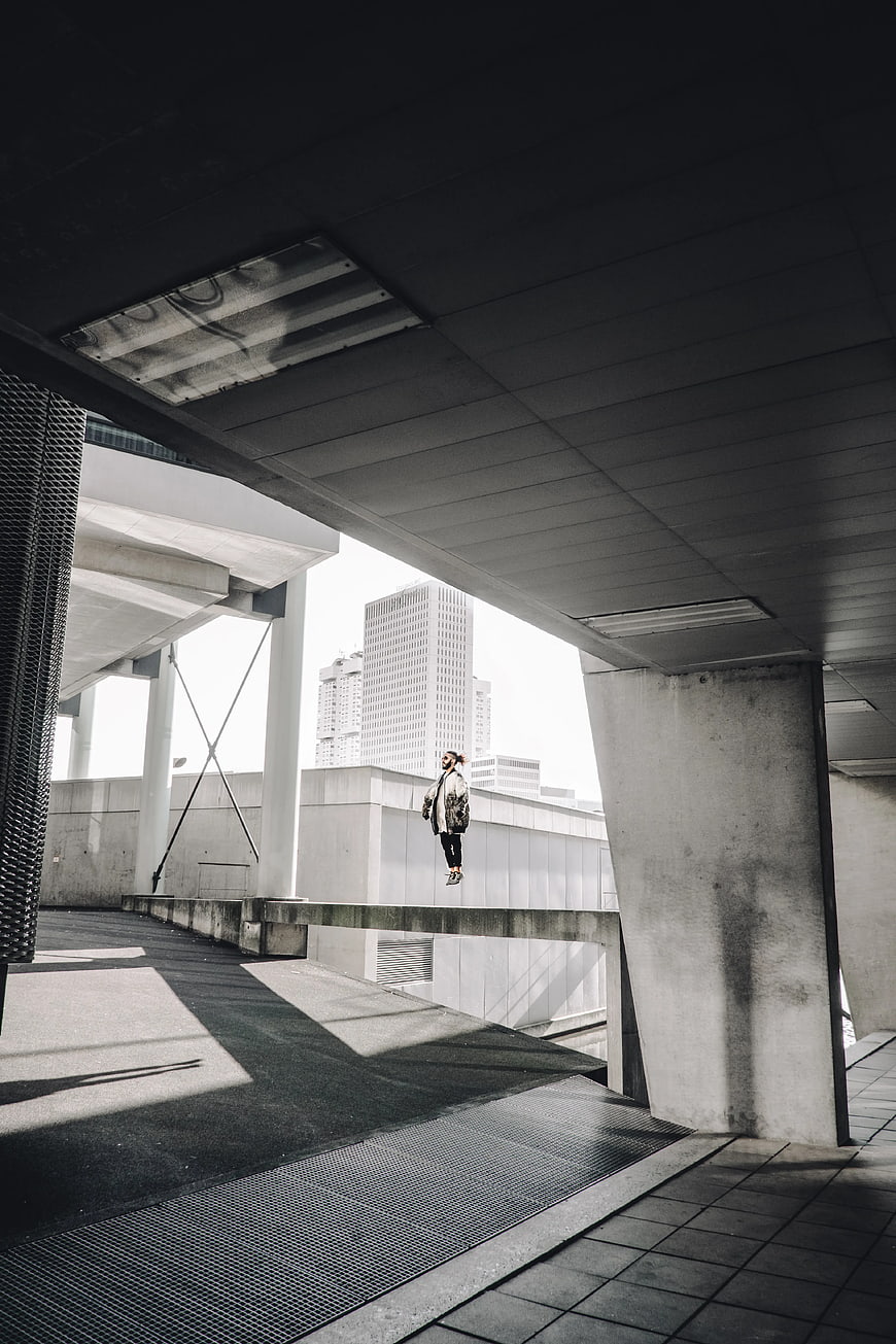 Man Floating in Brutalist Concrete Architecture