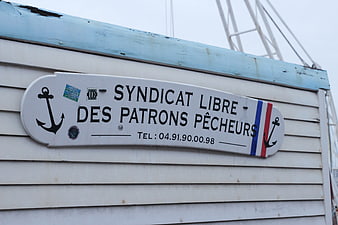 French Fishing Union Sign on Wooden Wall