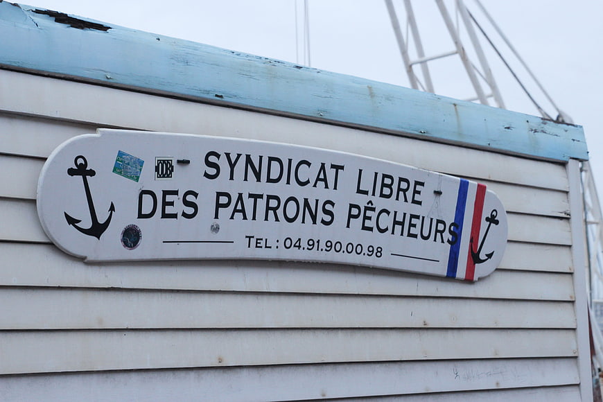 French Fishing Union Sign on Wooden Wall