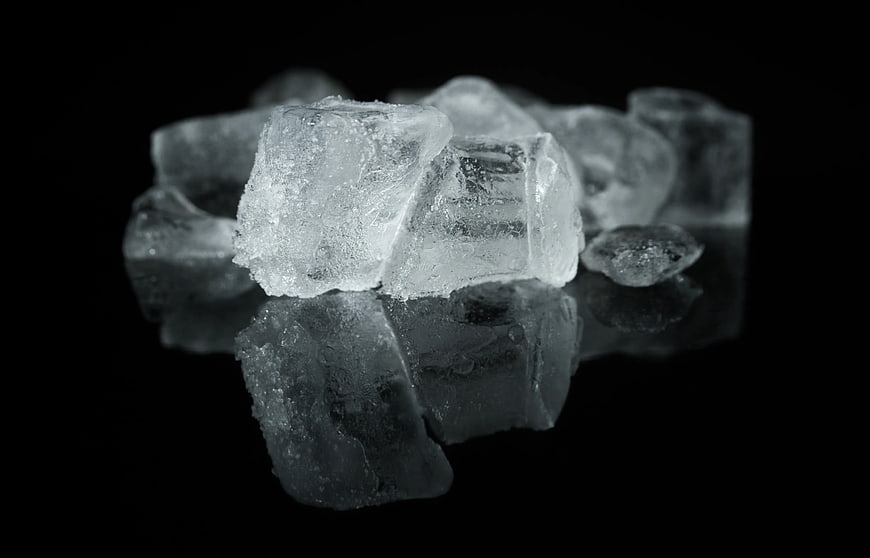 Ice Cubes on Black Reflective Surface