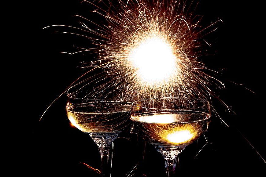Champagne Glasses with Sparkler on Black Background