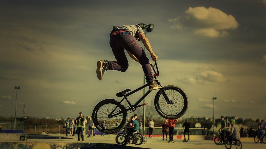 BMX Rider Performing Mid-Air Trick at Skatepark