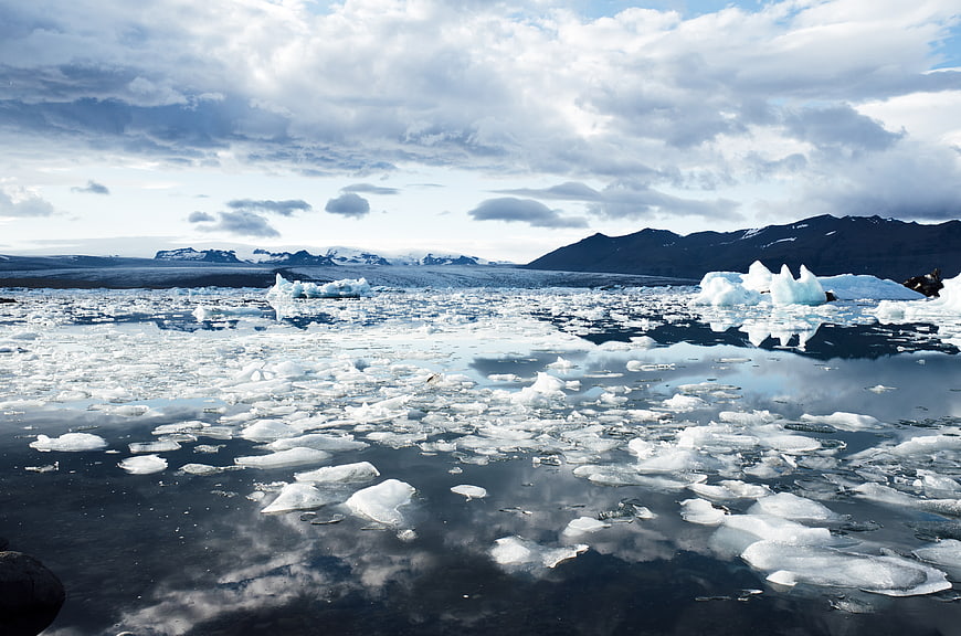 Icelandic Glacier Lagoon with Floating Icebergs and Mountains