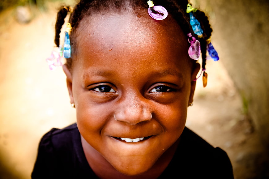 Close-up portrait of smiling African girl with colorful beads