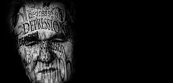 Man's face covered in depression text on black background
