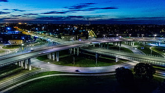 Aerial Night View of Riga Highway Interchange and City Lights