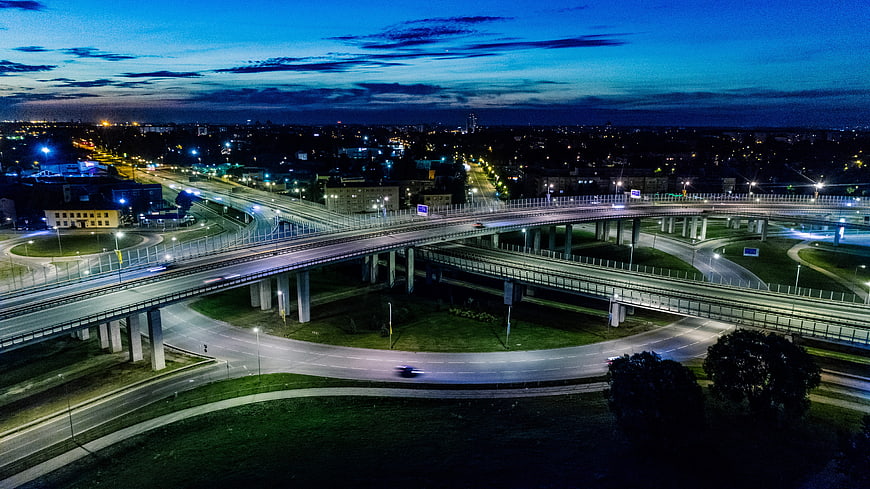 Aerial Night View of Riga Highway Interchange and City Lights