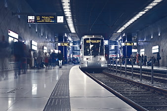 Modern subway train arriving at underground station platform