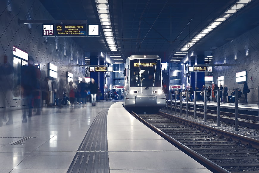Modern subway train arriving at underground station platform