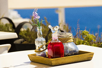 Spa oils and lavender on wooden tray with sea view