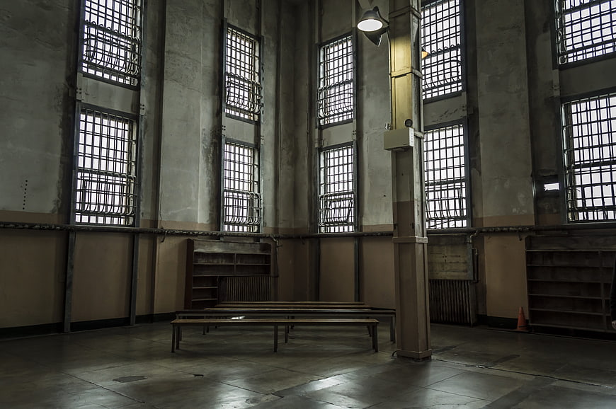 Historic Alcatraz Prison Interior With Barred Windows And Concrete Walls